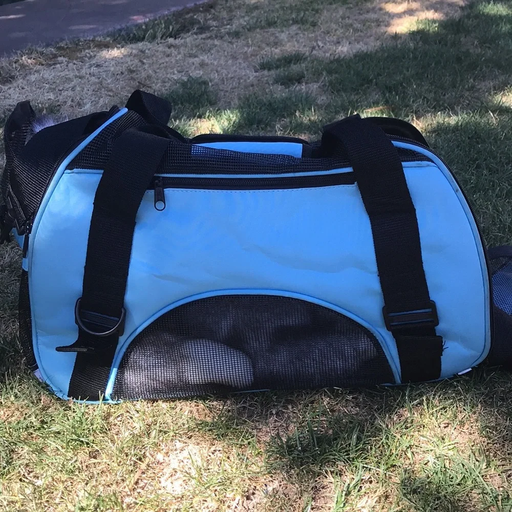 - Pet Carrier with shoulder strap light blue and black well vented used 1x